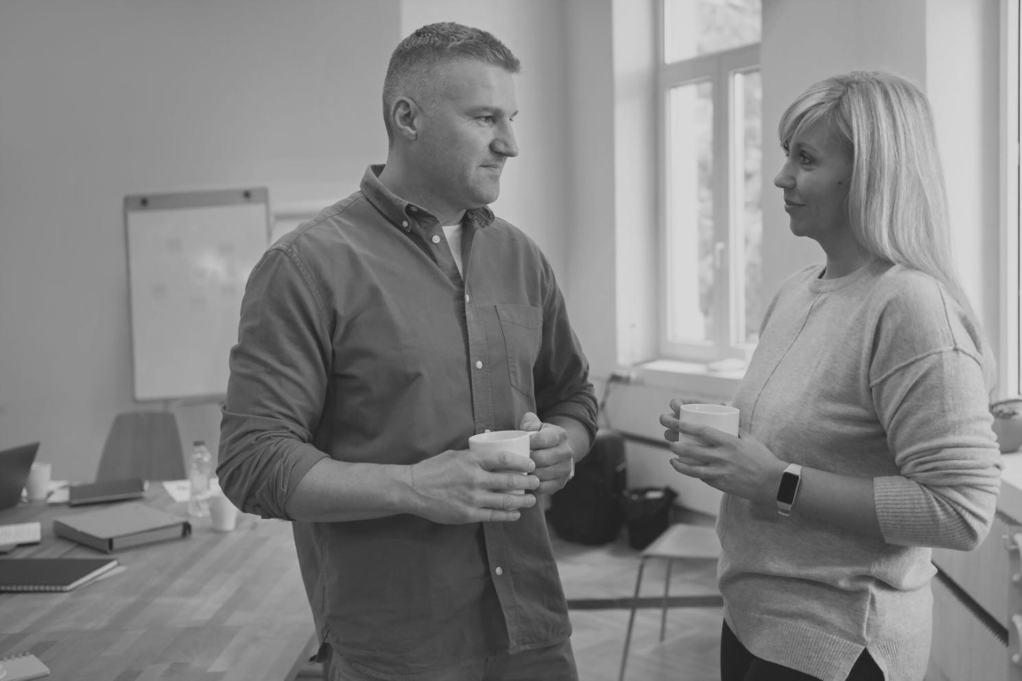 Business professional analyzing communication data and metrics on computer screen